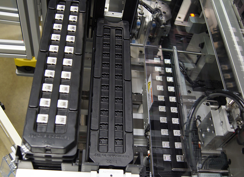 Tray load/unload